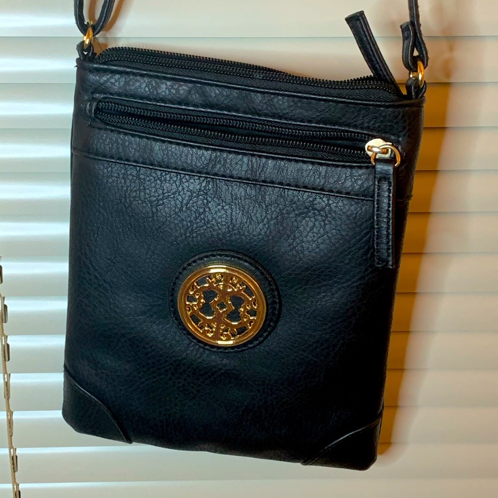 Faux leather purse. Unsure what brand. Cool style.